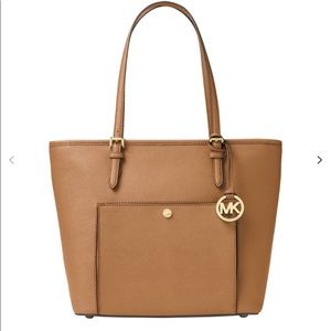 Michael Kors Jet Set leather tote purse.